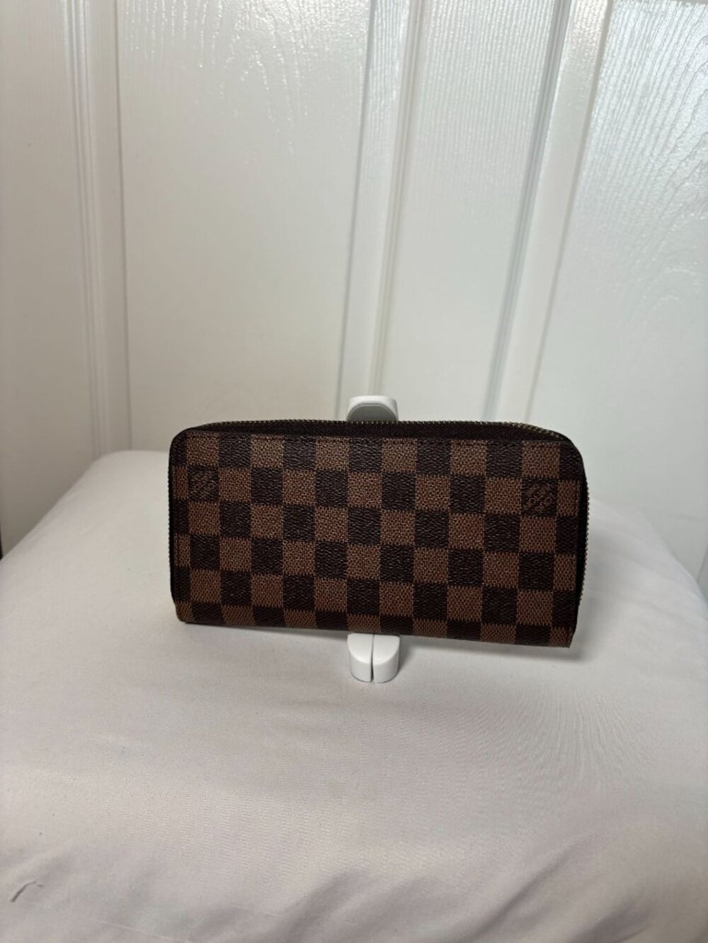 Designer-inspired checkered zip around wallet in brown with gold hardware,